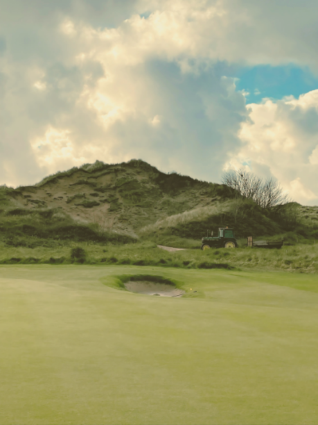 tractor and dune at royal st. david's golf club